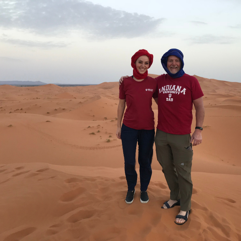 HIEP recipients in Africa - HIEP recipient and a friend in IU gear pose on a sand dune in Morocco