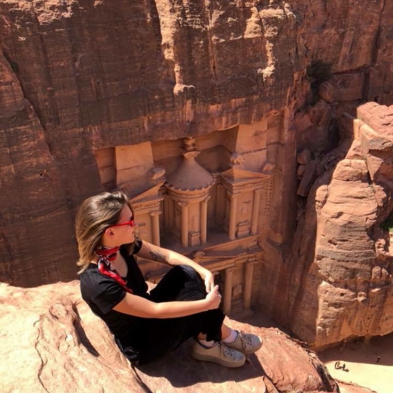 HIEP recipients in Asia and the Middle East - Annalisa Thielmann sits on a rock outcropping overlooking the city of Petra in Jordan.