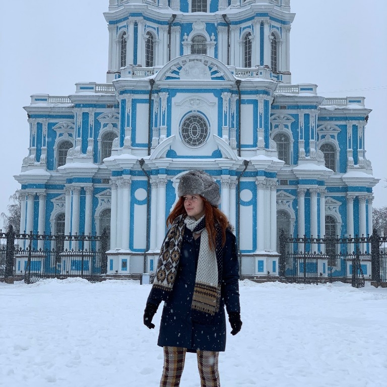 HIEP recipients in Asia and the Middle East - Olivia Eich poses for a photo in the snow outside the University of St. Petersburg after her first day of class while studying abroad.