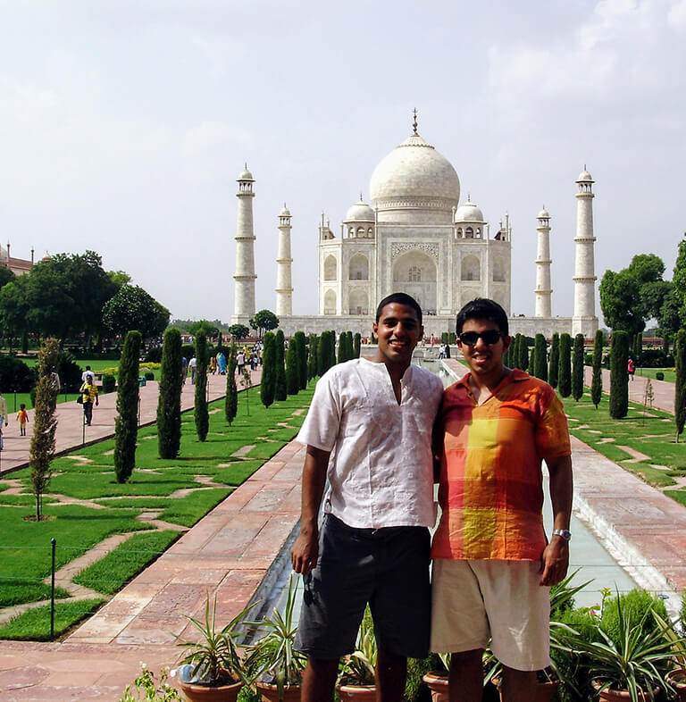 HIEP recipient photo from travel in Asia and the Middle East - friends pose for a photo in Agra with the Taj Mahal in the background