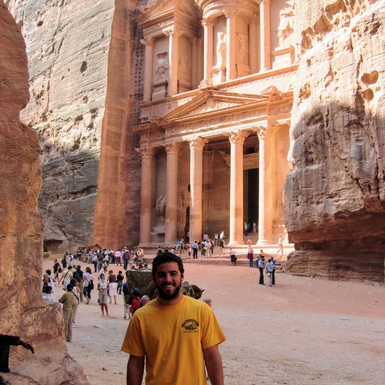 HIEP recipient photo from travel in Asia and the Middle East - student poses for a photo in front of the city of Petra in Jordan