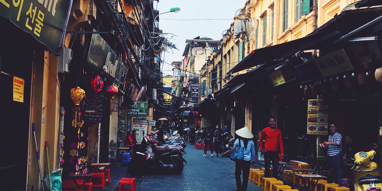 HIEP recipients in Asia and the Middle East - Riley Petty's photo of a busy street in Vietnam crowded with stores and outdoor restaurant seating.