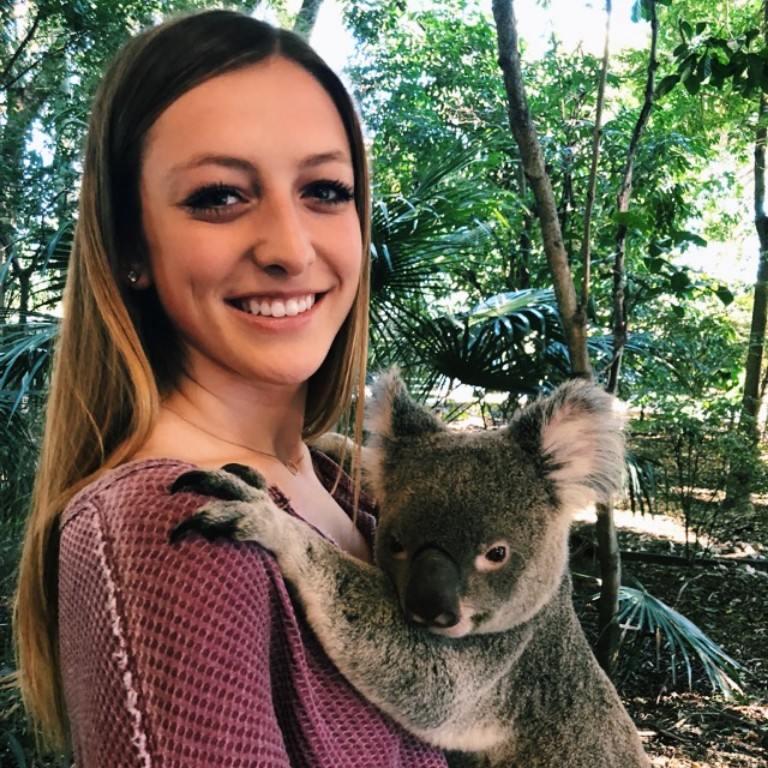 HIEP recipients in Australia - Chloe Vance poses with a koala in Brisbane Australia