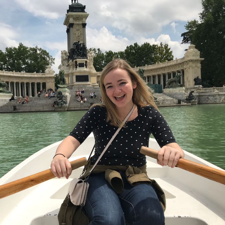 HIEP recipients in Spain - Kelsey Vonderohe paddles a small boat near a large historic monument in Madrid